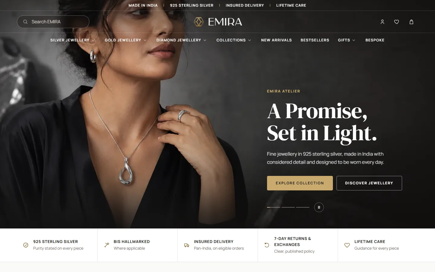 Screenshot of the EMIRA homepage: model wearing a silver pendant beside the headline “A Promise, Set in Light.”